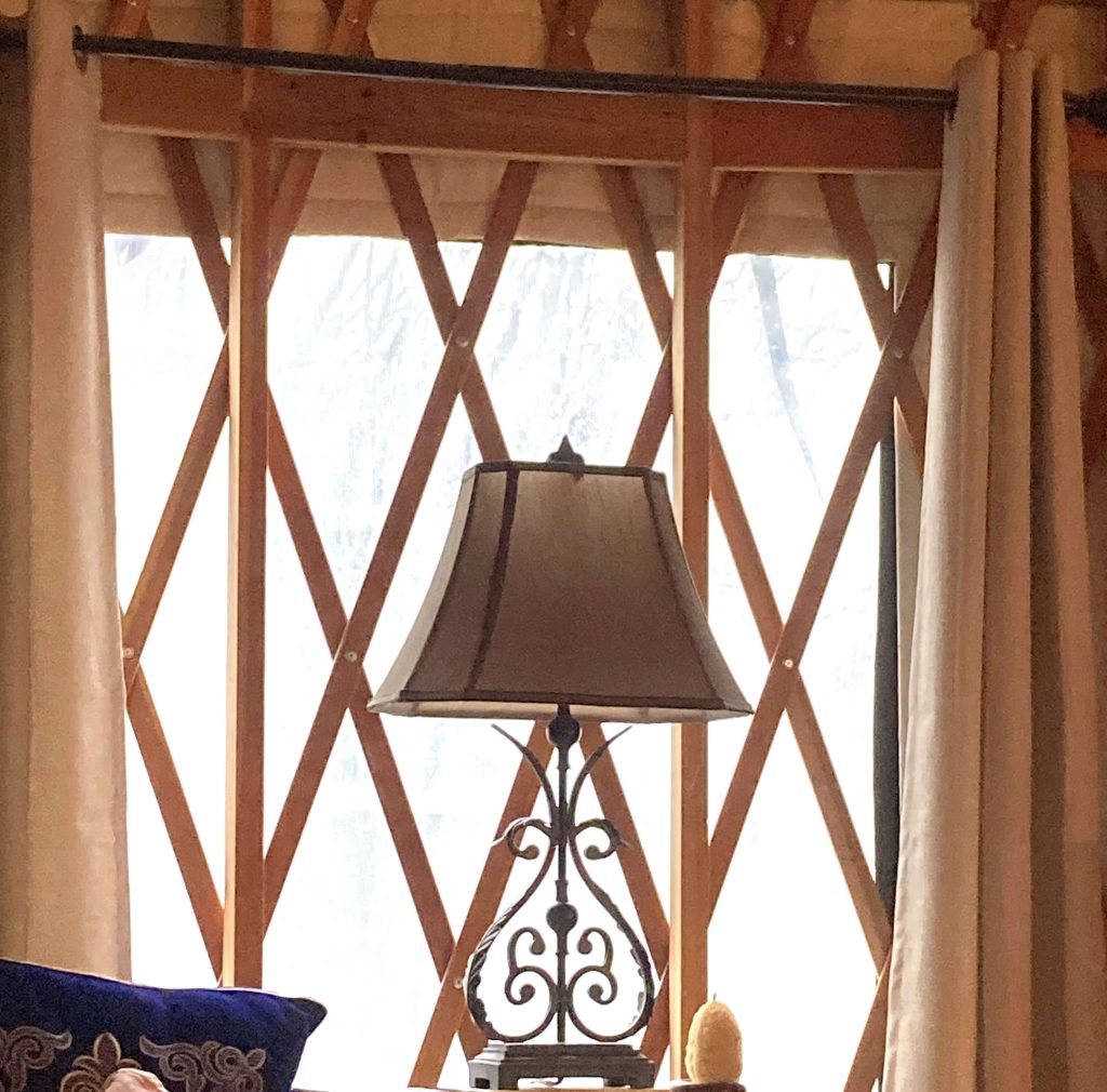 Yurt window from inside with lattice overlaid