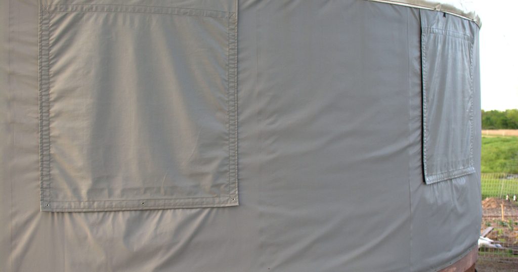 Grey wall with fabric roll up windows